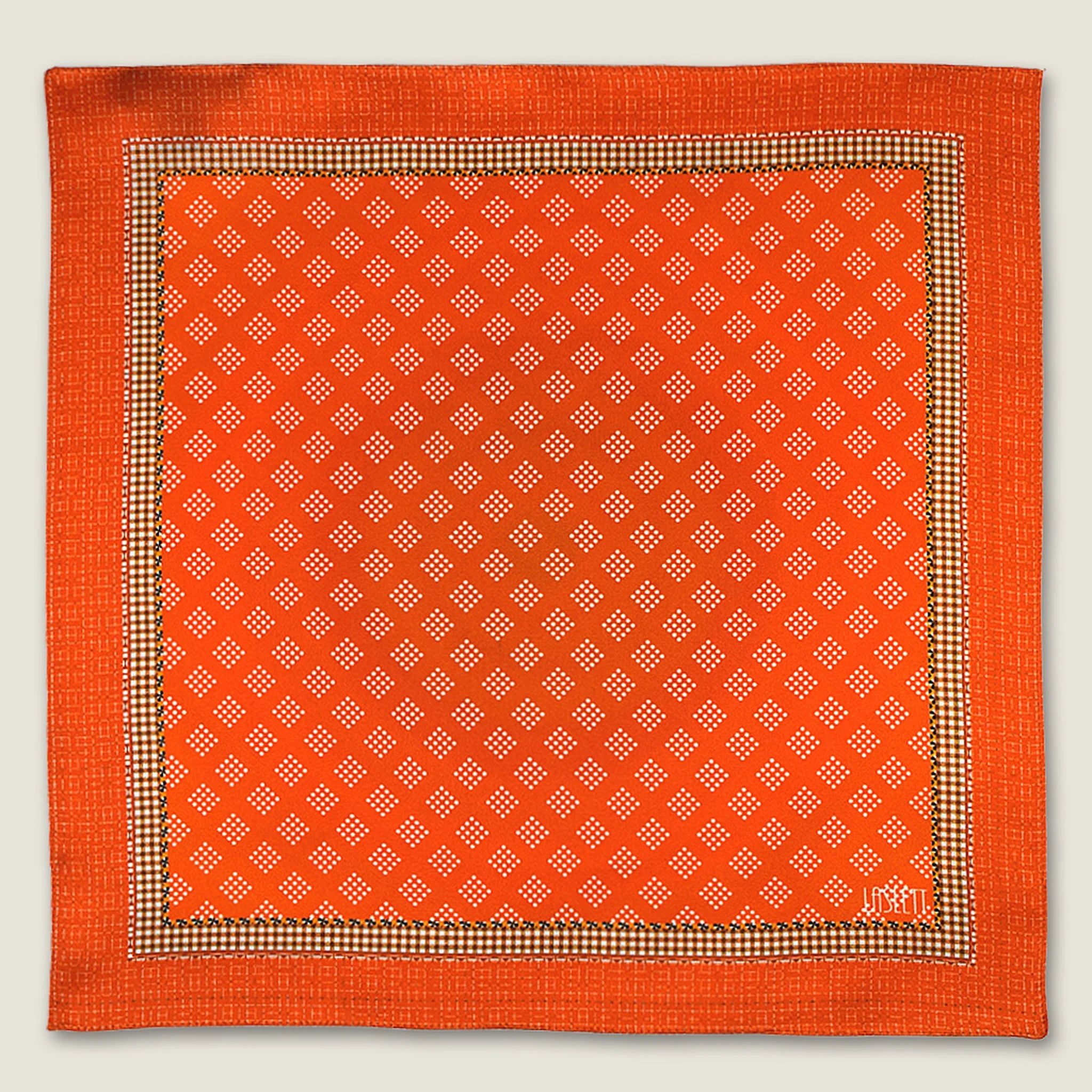 100% silk Batik Orange Pocket Square in orange by Laslett England shown in flat lay.