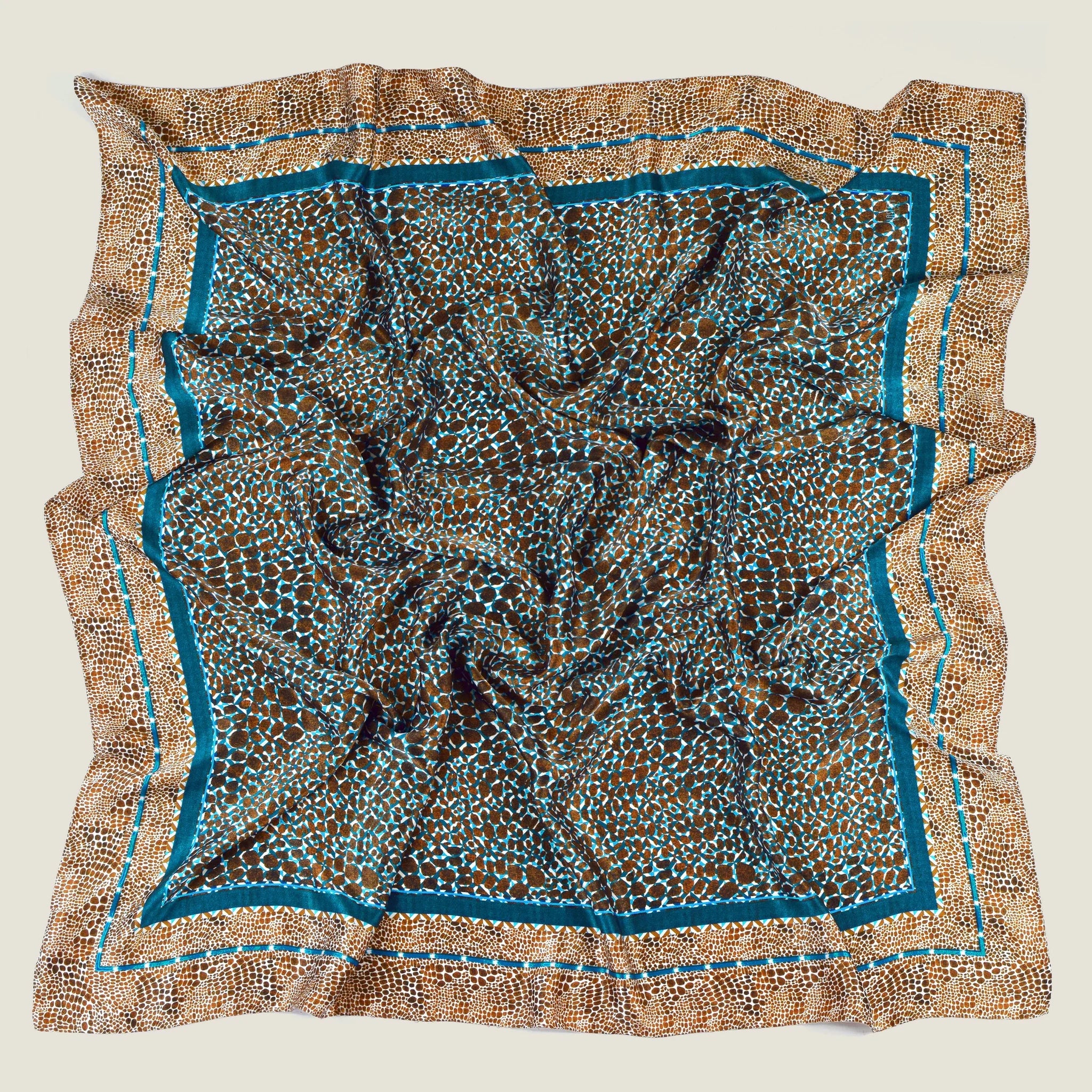 Laslett England classic square silk scarf flat lay, teal and bronze animal print with hand-rolled edge.