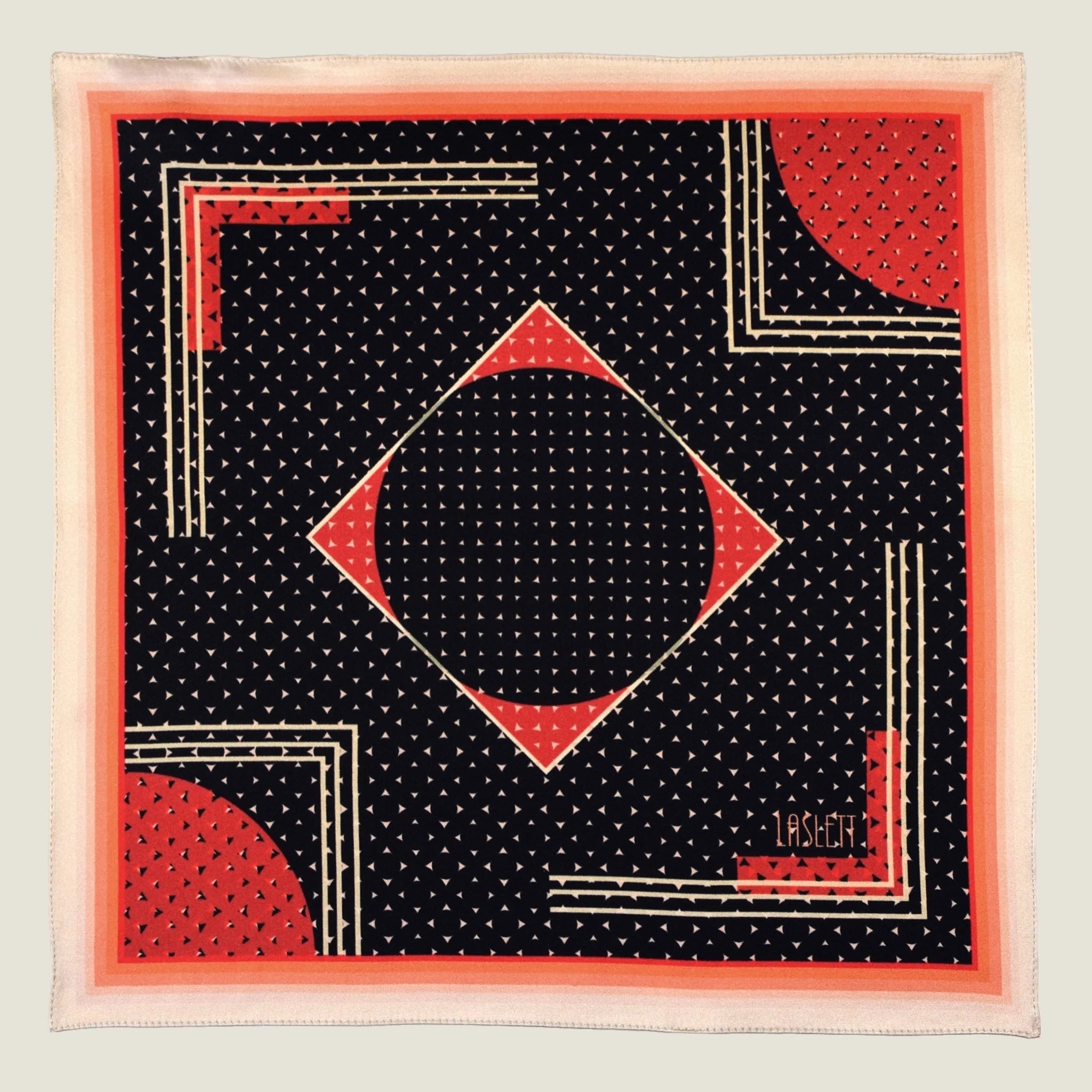 Laslett England Deco Noir pocket square flat lay, black silk with red and gold Art Deco geometric print.