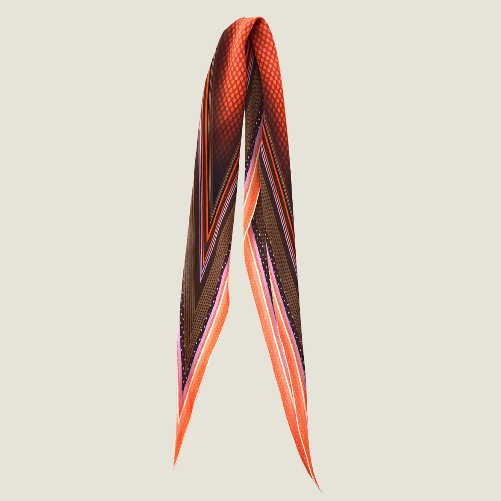 100% silk Dream Coral Laslett Diamond in orange and brown by Laslett England. Pictured against a neutral background folded loosely in half.