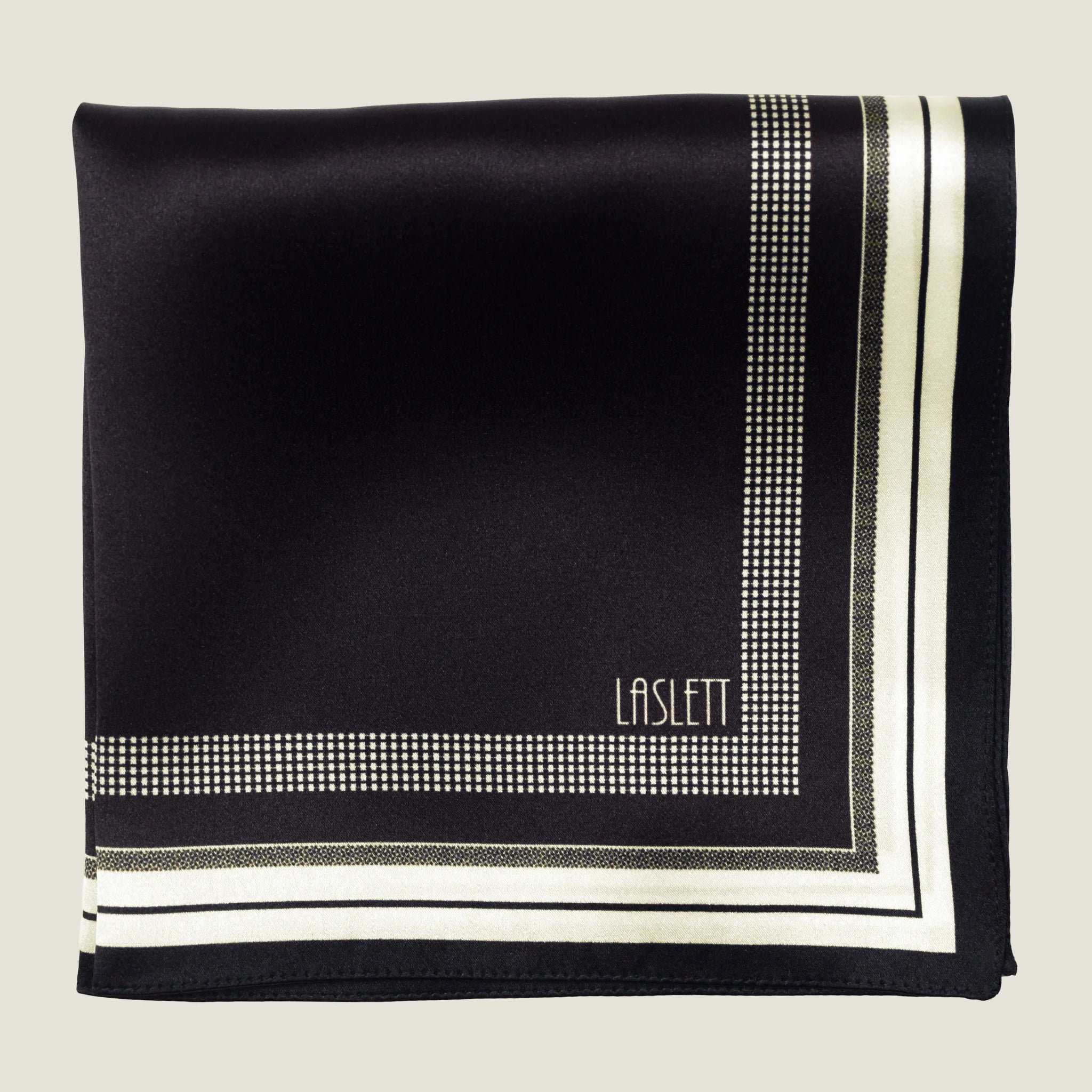 Laslett England Gambit Ivory silk pocket square flat lay, black ground with ivory and fine-stripe border.