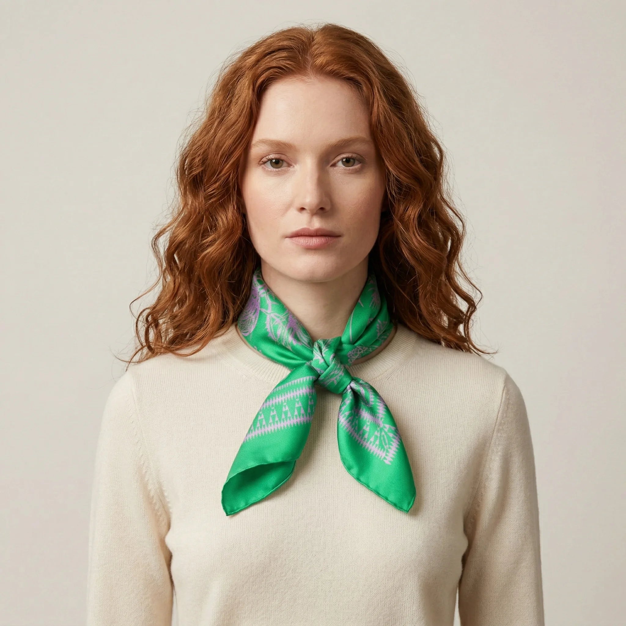 100% silk Marettimo Jewel Green Silk Bandana by Laslett England. Scarf is knotted at a model's neck cowboy style.