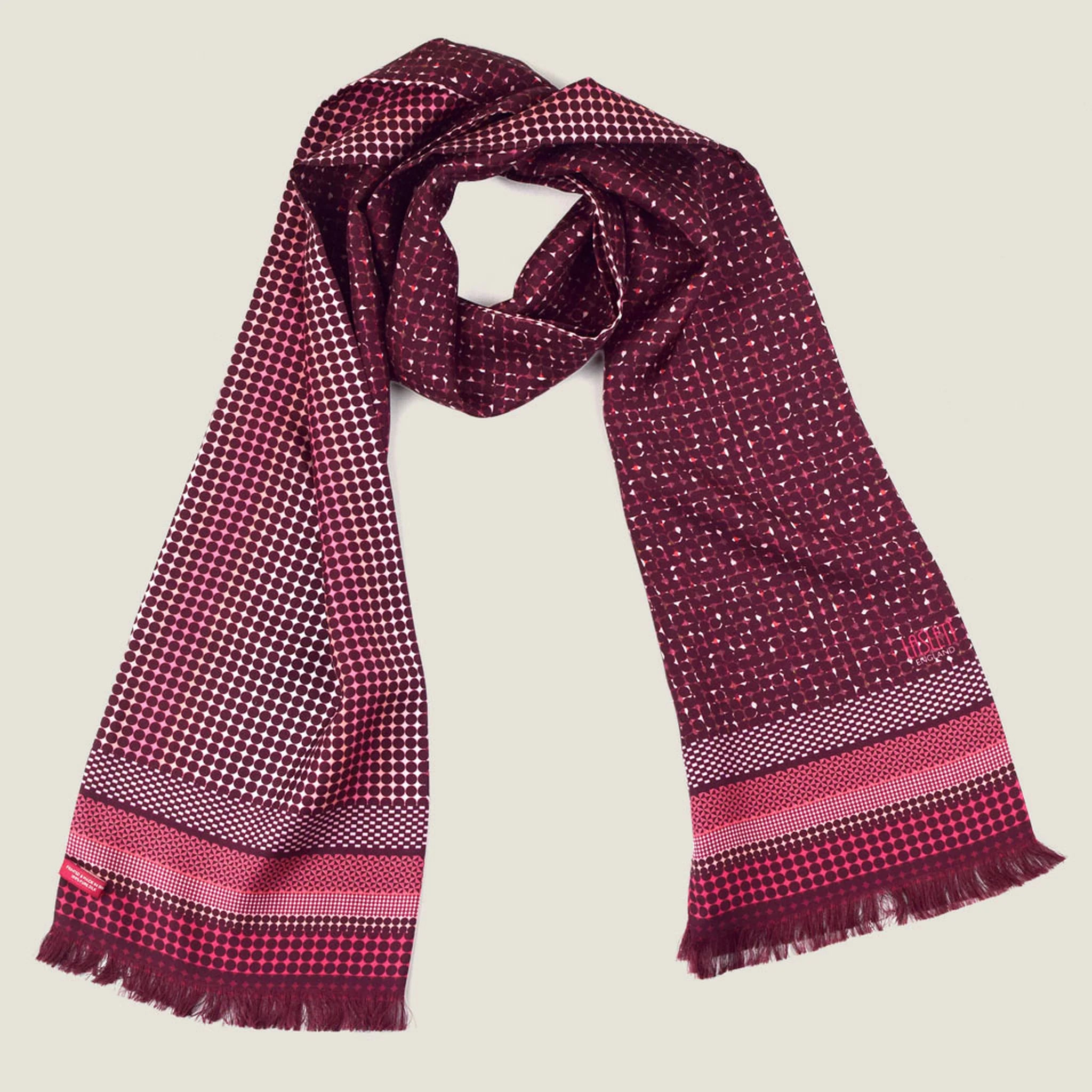 Laslett England Monaco Burgundy Silk Oblong flat lay, 21cm x 165cm double-sided silk twill in deep burgundy with white and pink dot print and stripe border, pin-fringed hem.