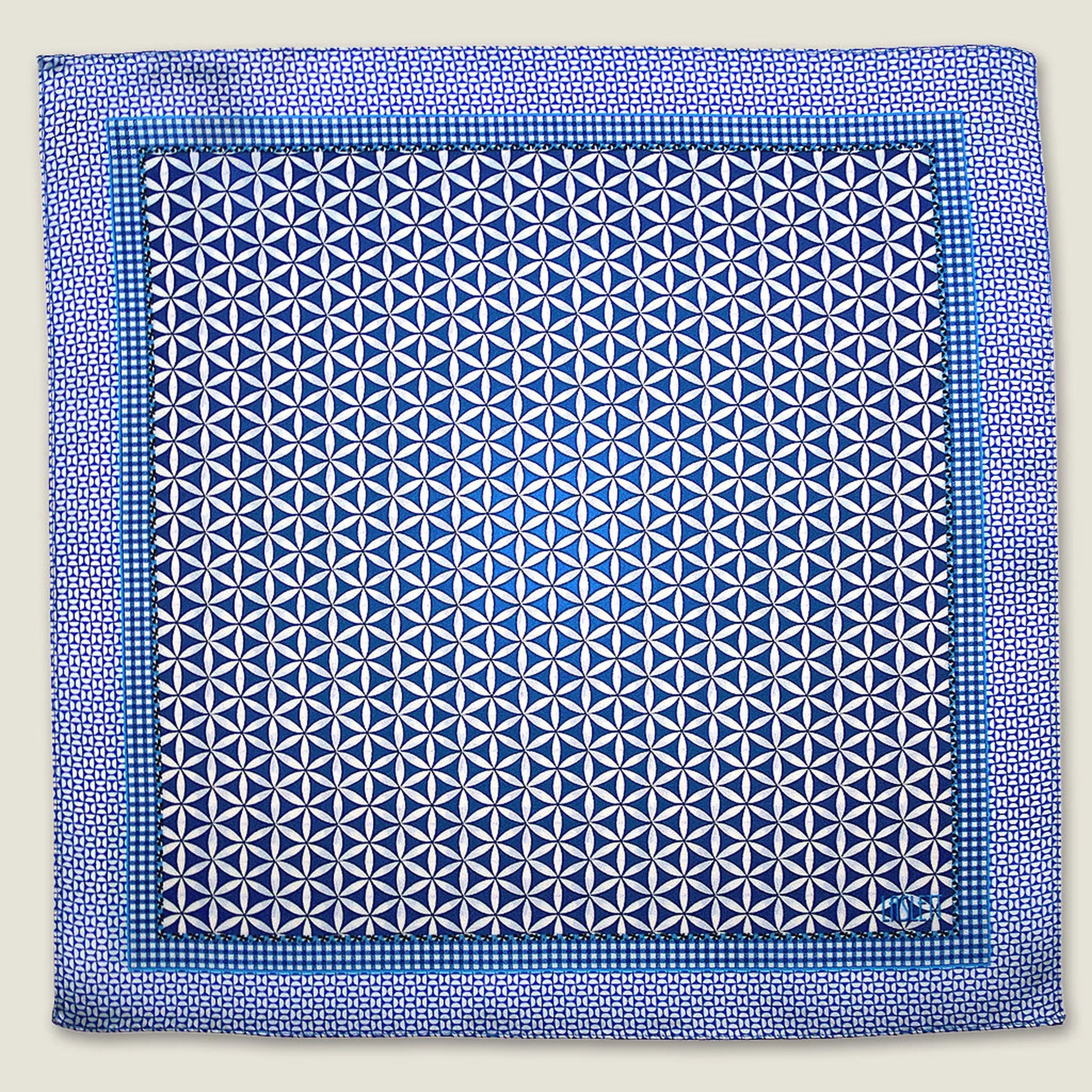 100% silk Moresque Blue Pocket Square in blue by Laslett England. Square is shown in flat lay.
