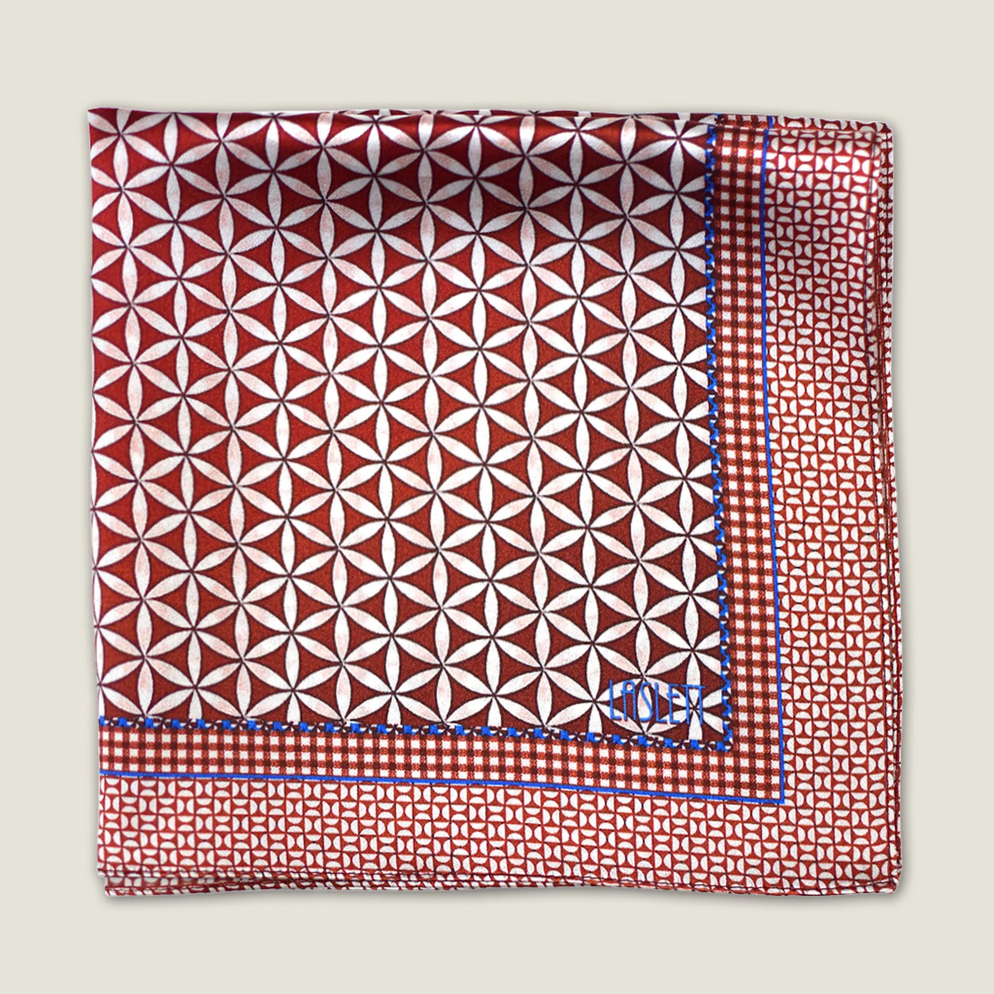 100% silk Moresque Bronze pocket square shown folded into fours in flat lay against a neutral background.