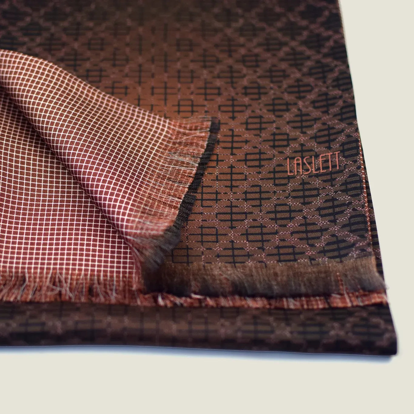 Laslett England Mosaic Copper Silk Oblong folded flat showing both sides, copper trellis print alongside terracotta micro check on 100% silk twill with pin-fringed hem.