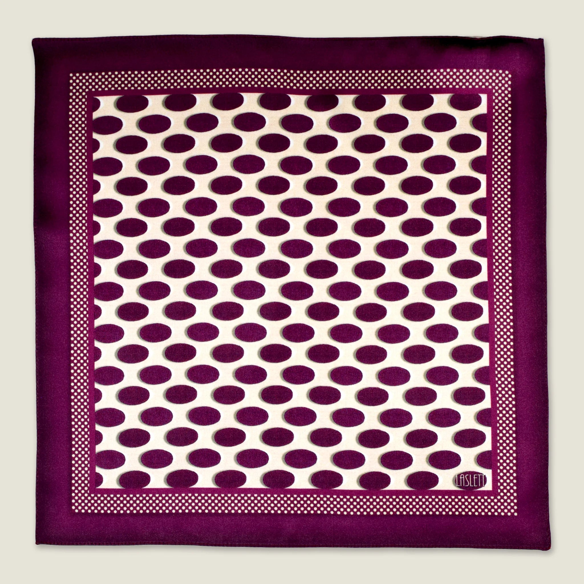 Oval Spot Burgundy pocket square in flat lay against a neutral background showing off the modern retro oval spot pattern.