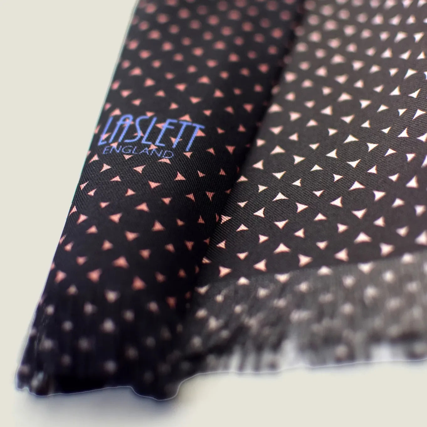 Laslett England Revival Mocha Silk Oblong detail showing mocha brown geometric print and pin-fringed hem on 100% silk twill.