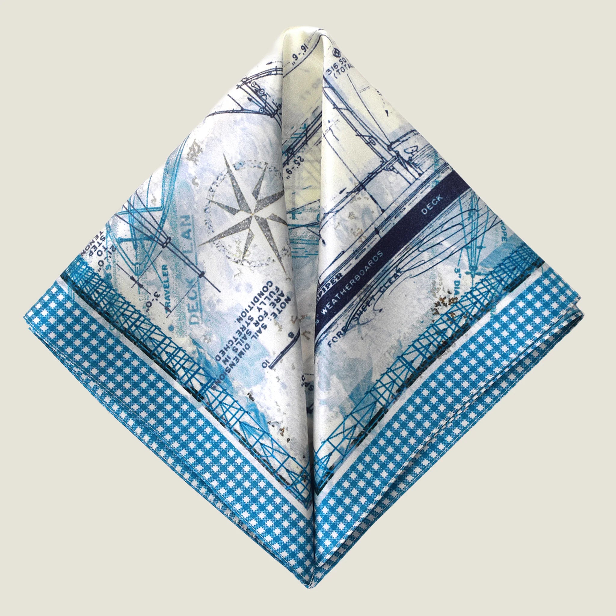 Laslett England Sandpiper Azure silk pocket square folded flat, blue and white nautical blueprint print with compass detail.