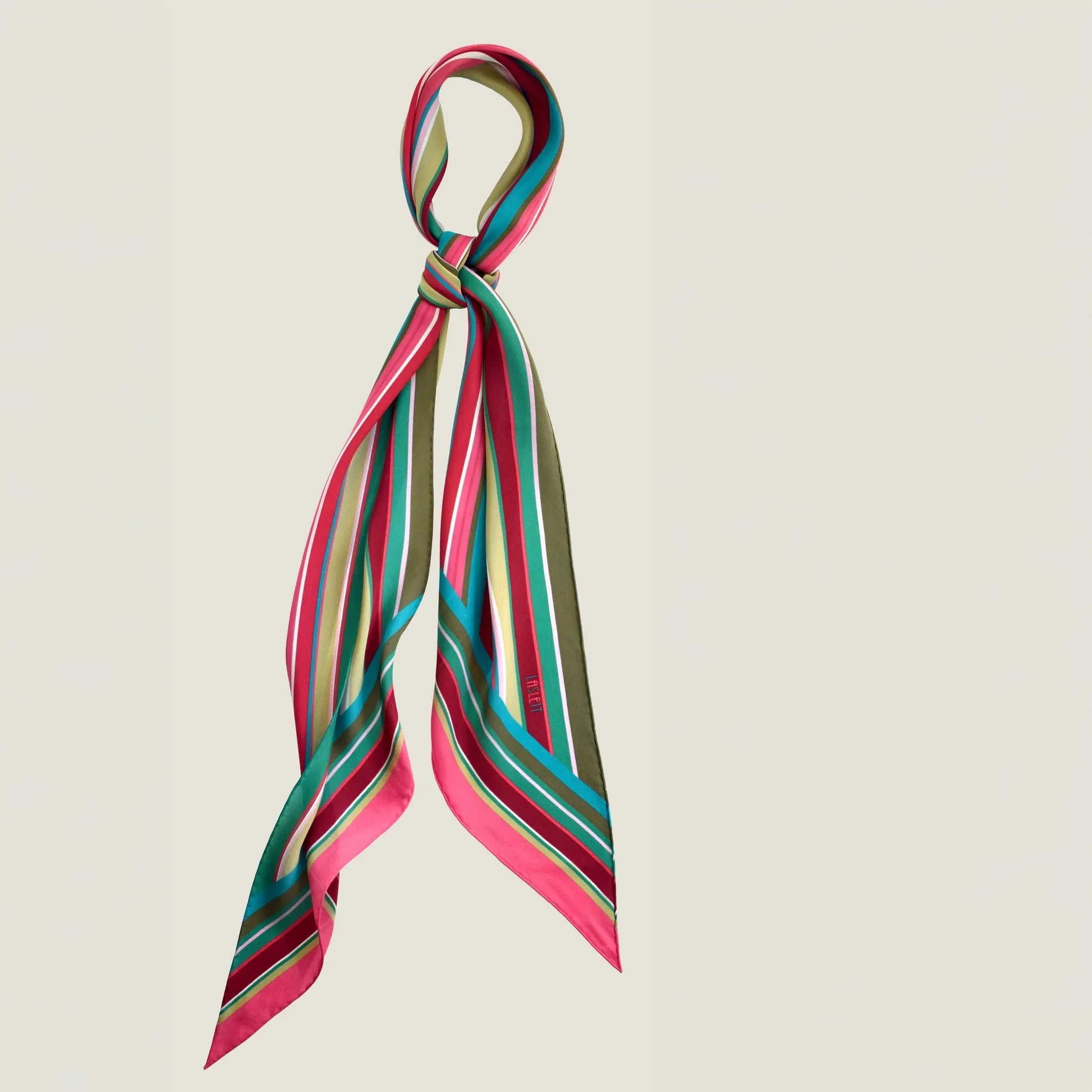 100% silk Seaside Vintage Chiffon Stole in pink and green by Laslett England. Scarf is shown knotted once at the neck.