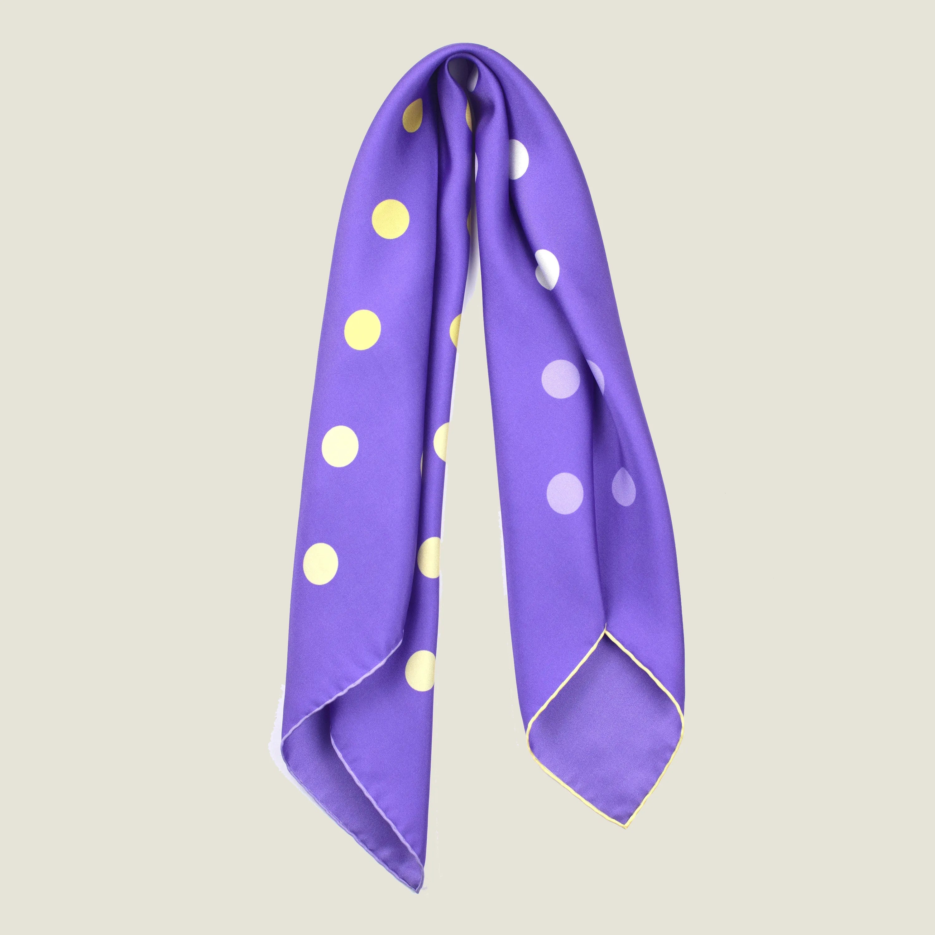 Laslett England Solitaire Violet Foulard flat lay folded into long strip, violet silk satin with lemon and cream polka dots and cream hand-rolled edge.
