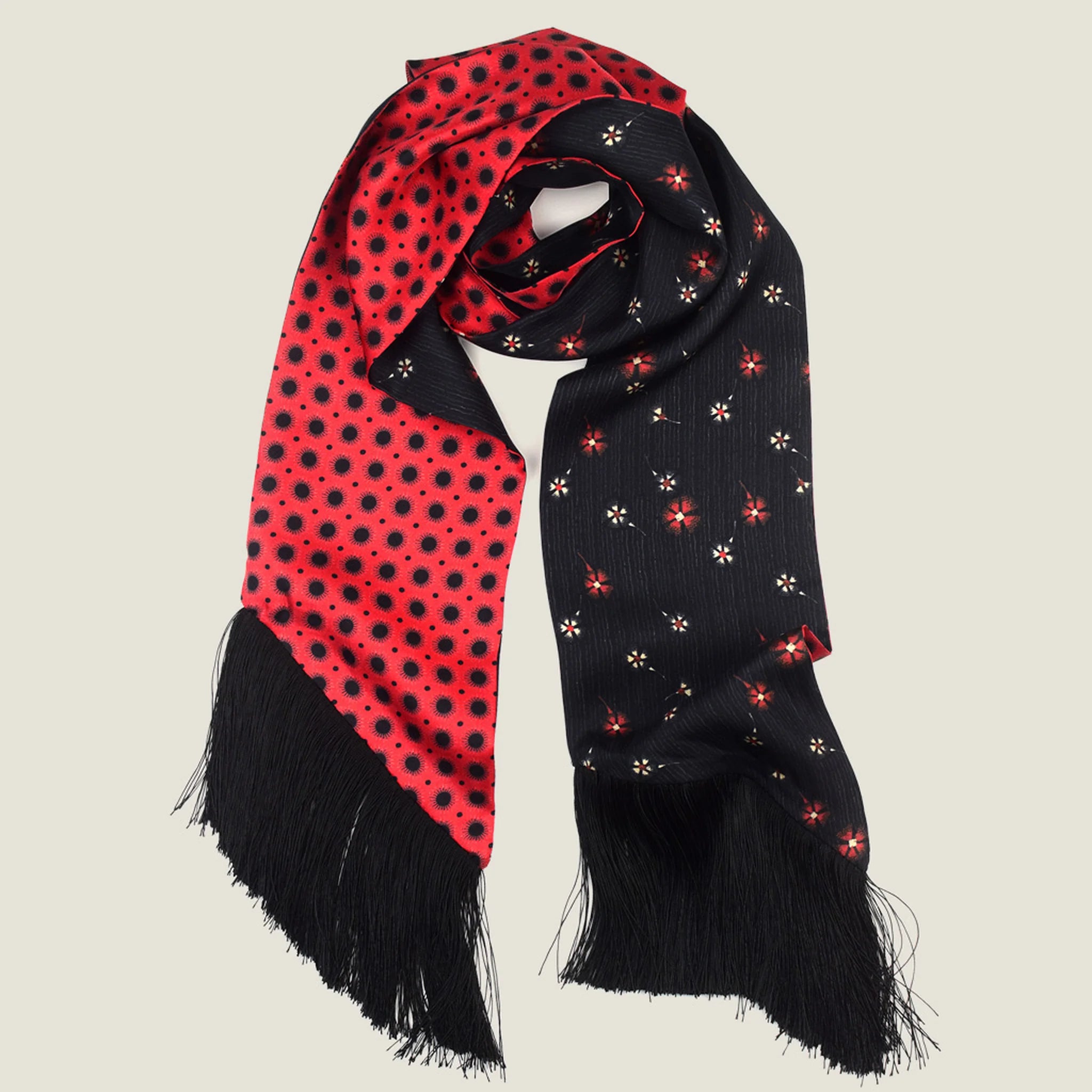 Laslett England Tuxedo Red Fringed Silk Scarf flat lay showing black reverse with small red floral sprigs on pinstripe ground and black tassel fringe.