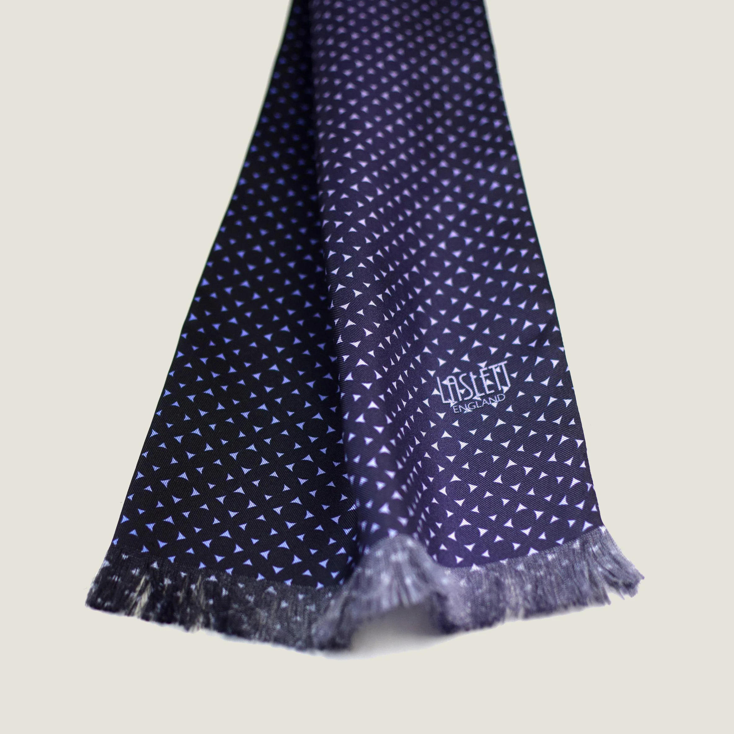 Laslett England Revival Navy Silk Oblong detail showing white pin dot print on deep navy 100% silk twill with pin-fringed hem