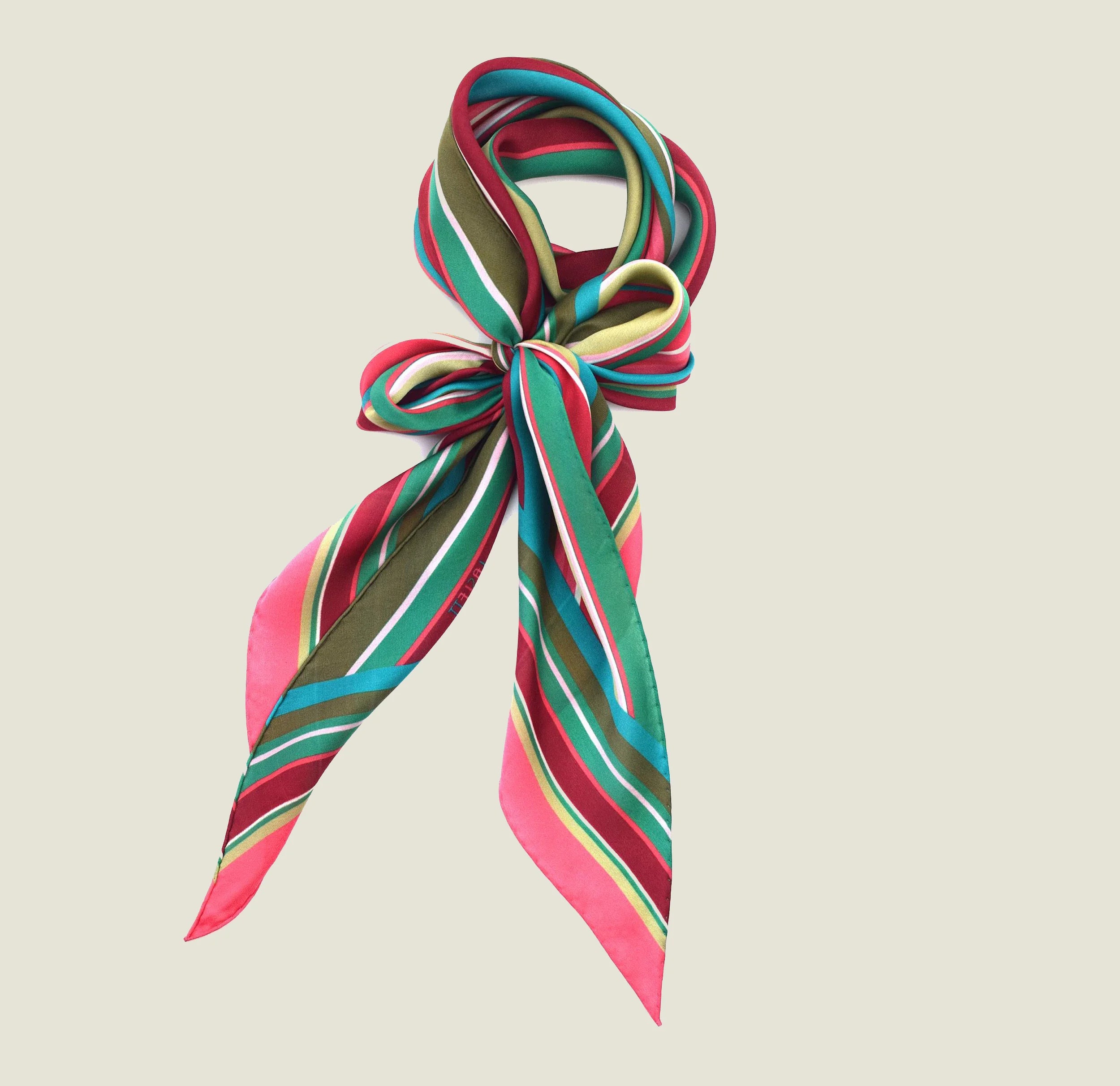 100% silk Seaside Vintage Chiffon Stole in pink and green by Laslett England. Product shot of stole shown tied in bow around the neck.