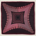 Houston Ruby Silk Bandana from Laslett England pictured in flat lay with a graphic radial stripe in ruby and rose pink. 
