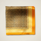 100% silk Matrix Gold Pocket Square has a futuristic geometric design that reveals, on closer inspection, repeating graphic lines and patterns across the surface. Square is shown folded into four on a neutral background. 
