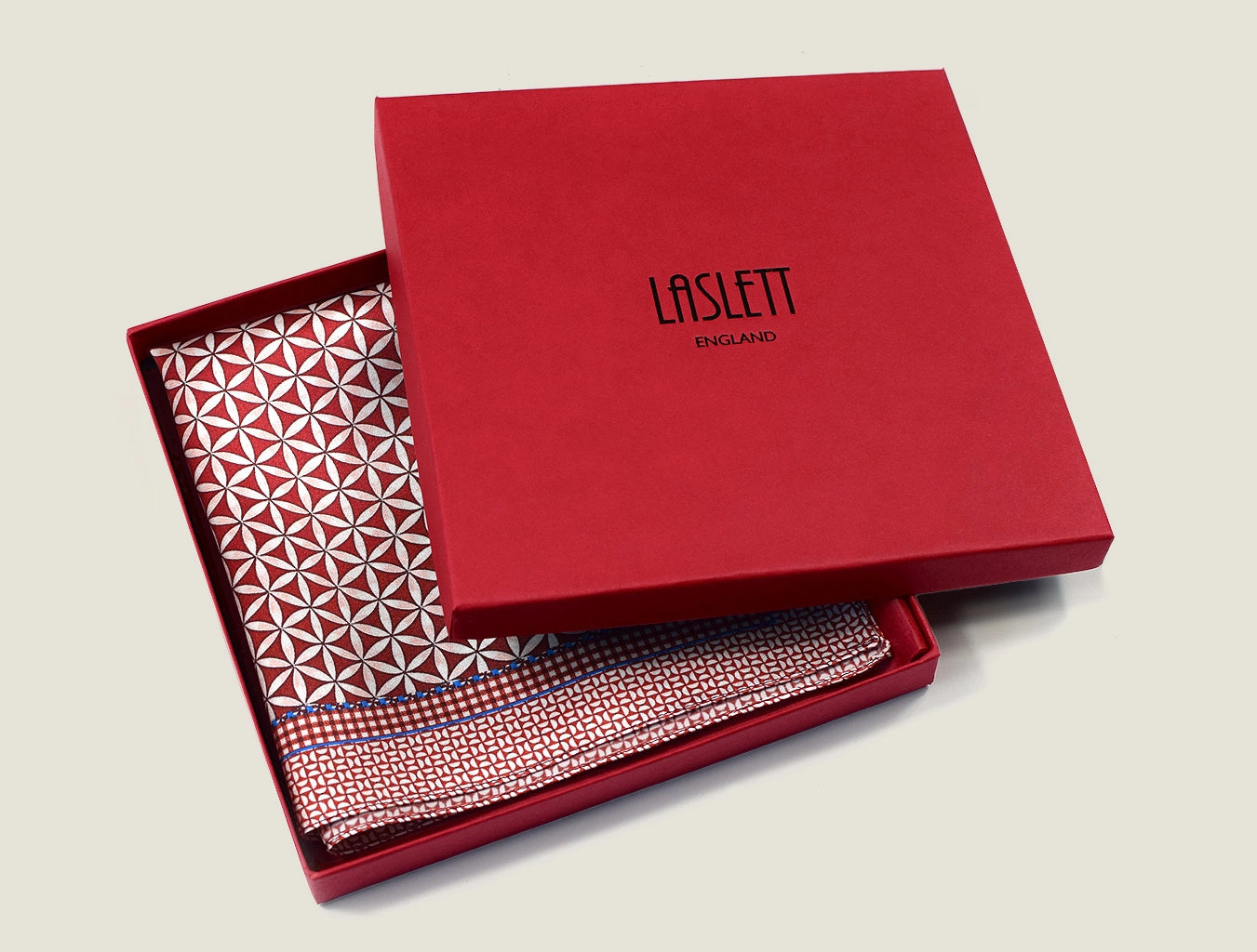 100% silk Moresque Bronze pocket square displayed in a signature red display box. 