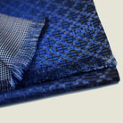Laslett England Lapis Blue silk oblong foldedwith a turned corner to show the contrasting geometric pattern on each side. 