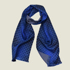 Laslett England Lapis Blue silk oblong product shot wrapped at the neck show the contrasting geometric pattern on each side. 
