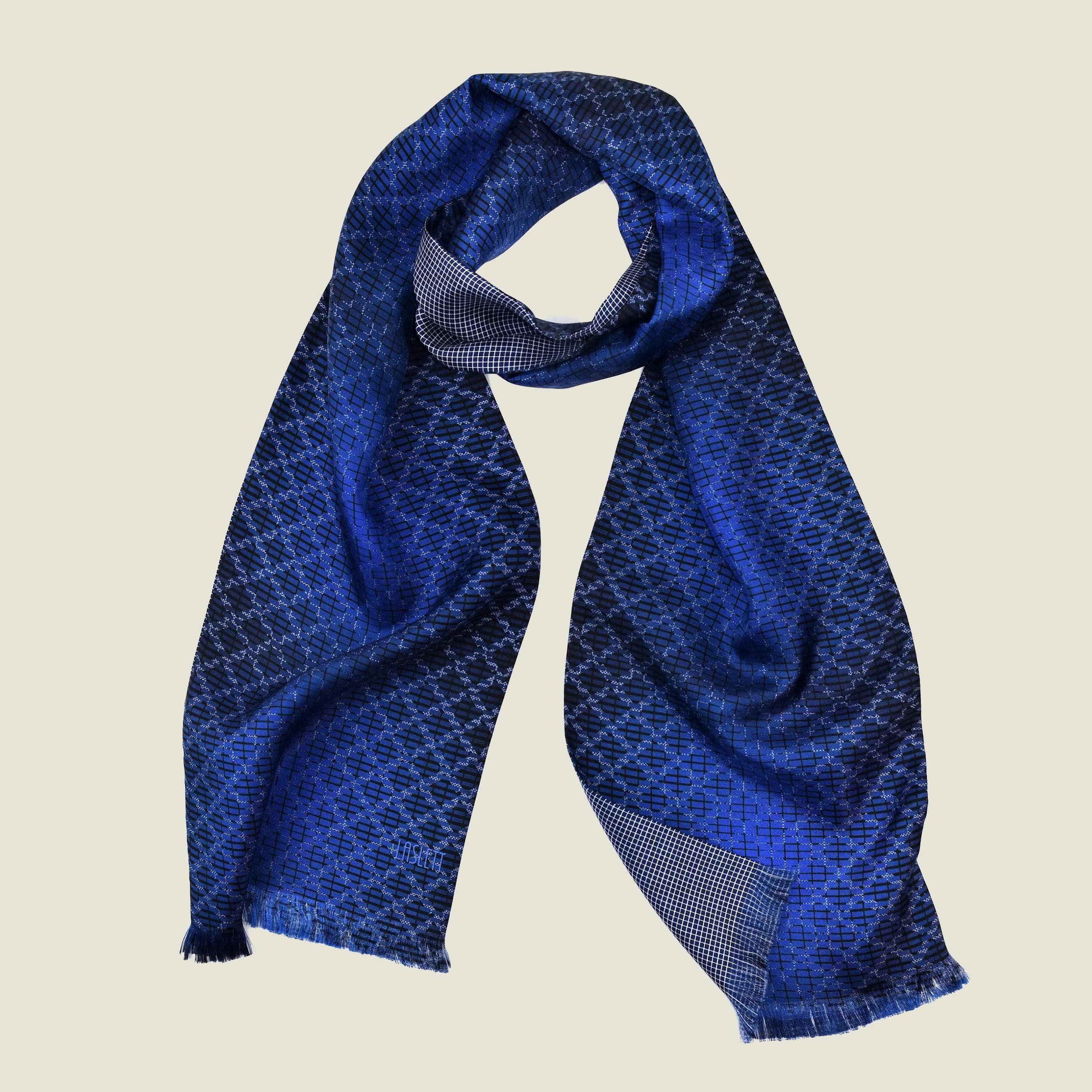 Laslett England Lapis Blue silk oblong product shot wrapped at the neck show the contrasting geometric pattern on each side. 