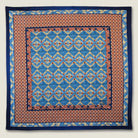 100% silk Aztec Blue Pocket Square in blue by Laslett England. Square is shown in a flat lay. 