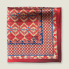 Laslett England Aztec Red pocket square flat lay, red ground with geometric Aztec repeat and navy border detail