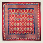Laslett England Aztec Red pocket square flat lay, red ground with geometric Aztec repeat and navy border detail.