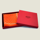 100% silk Batik Orange Pocket Square in orange by Laslett England shown in the signature red box. 