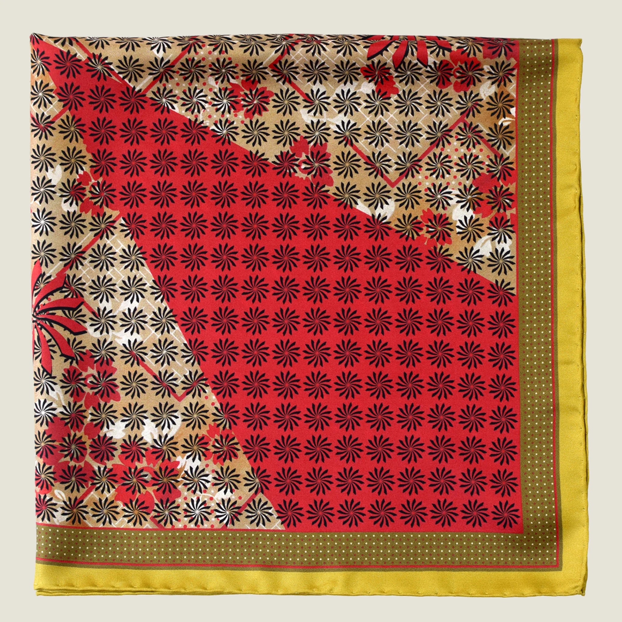 Laslett England Cadiz Silk Bandana folded flat showing camel floral and red spot sections of multi-pattern radiating print.