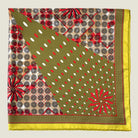 Laslett England Cadiz Silk Bandana folded flat showing olive and red geometric sections of radiating print on 100% silk twill.