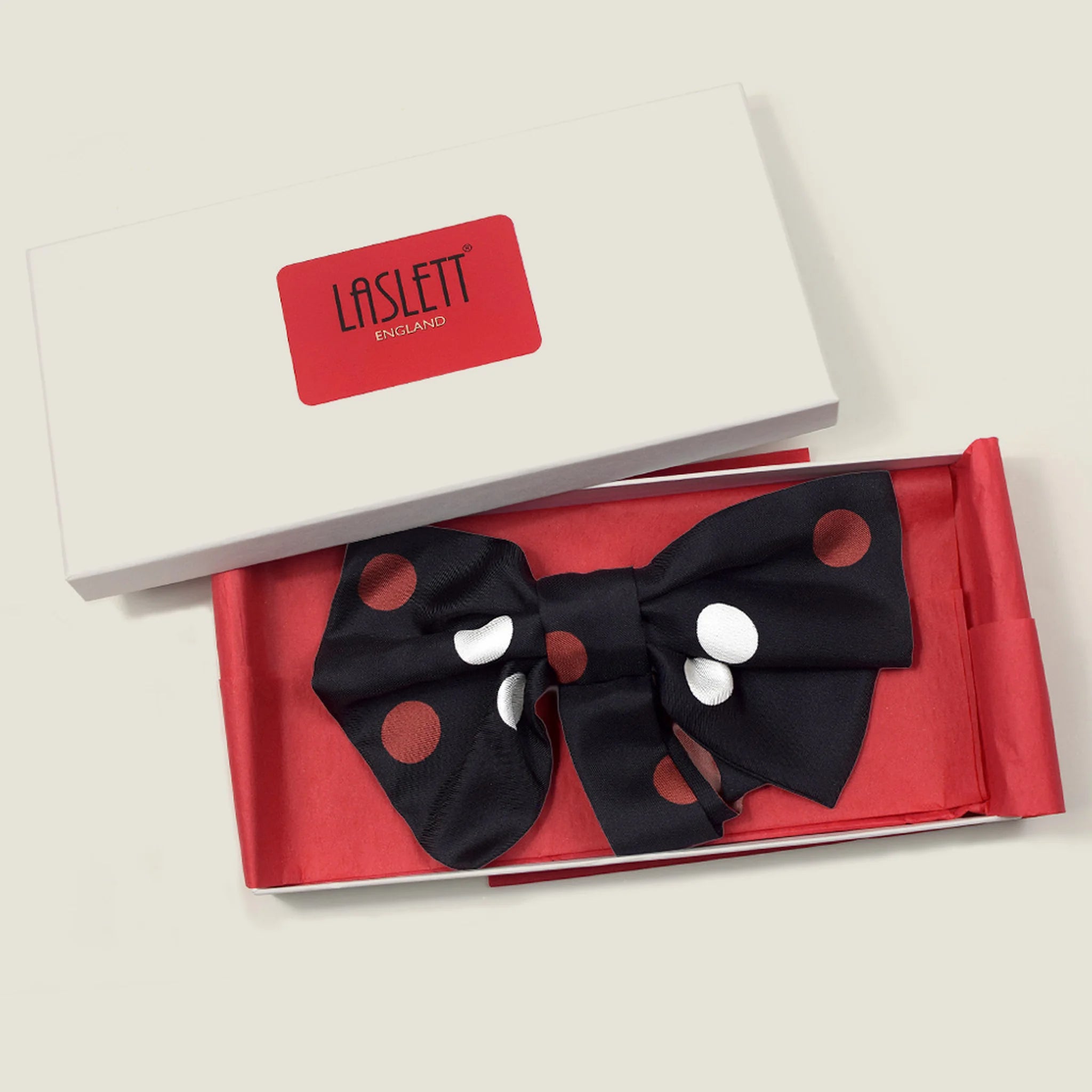 100% silk Coco Silk Bow in black and red by Laslett England photographed in a red and white signature Laslett England box. 
