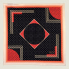 Laslett England Deco Noir pocket square flat lay, black silk with red and gold Art Deco geometric print.