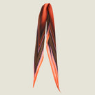 100% silk Dream Coral Laslett Diamond in orange and brown by Laslett England. Pictured against a neutral background folded loosely in half.
