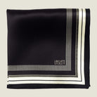 Laslett England Gambit Ivory silk pocket square flat lay, black ground with ivory and fine-stripe border.