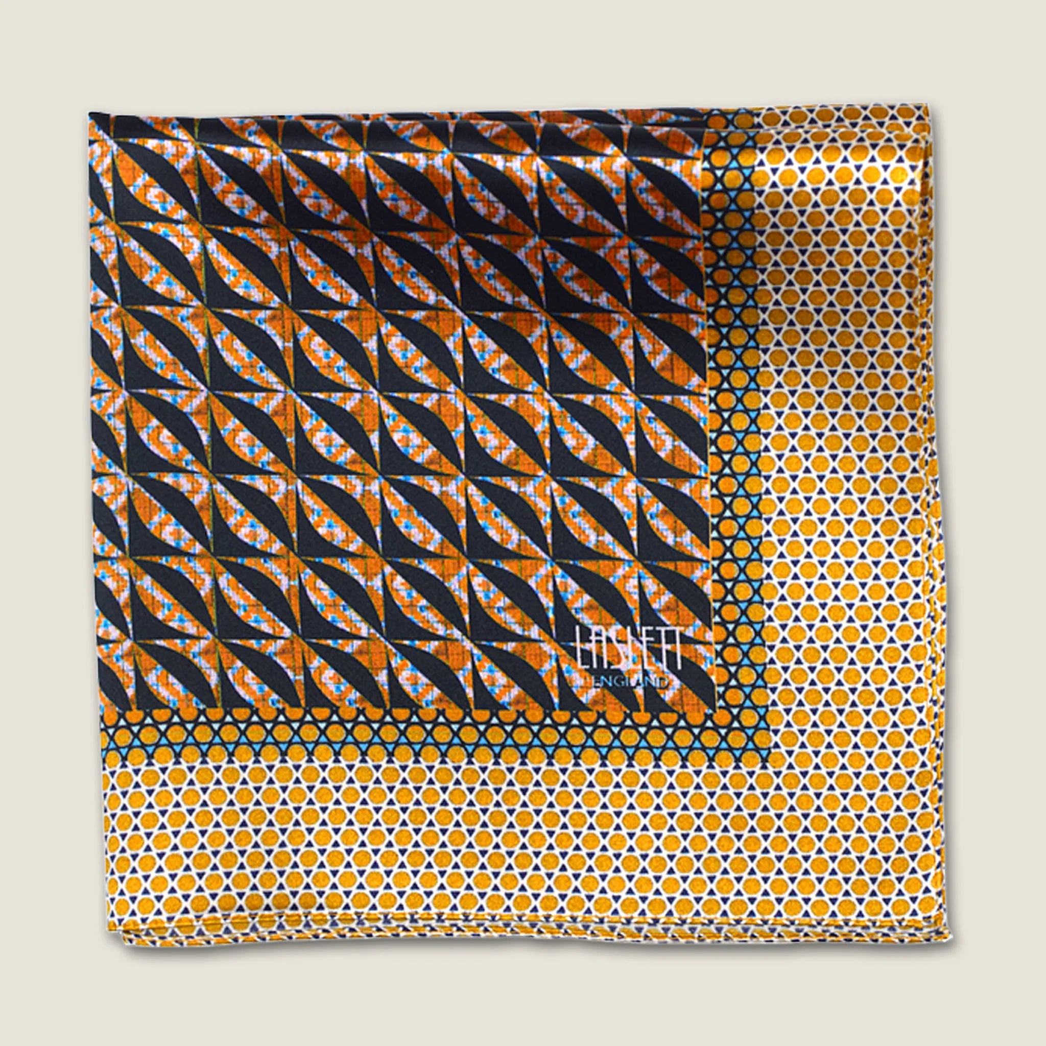 100% silk Havana Camel Pocket Square in gold and black with orange and green highlights by Laslett England. Scarf is folded in four against a neutral background with the Laslett England logo shown on the design. 