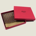 100% silk Havana Camel Pocket Square in gold and black with orange and green highlights by Laslett England. Scarf is displayed in a signature red box. 