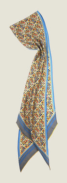 100% silk Laura Chiffon Stole in blue and yellow floral by Laslett England. Folded in half on a neutral background. 