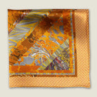 100% silk Marble Amber pocket square is inspired by the decorative marbled papers found inside antique and fine books. Shown folded into four against a neutral background. 