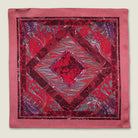 100% silk Marble Red pocket square print carries the flowing, layered quality of traditional hand-marbling in deep red and cream tones with a geometric border. Photographed in flat lay. 