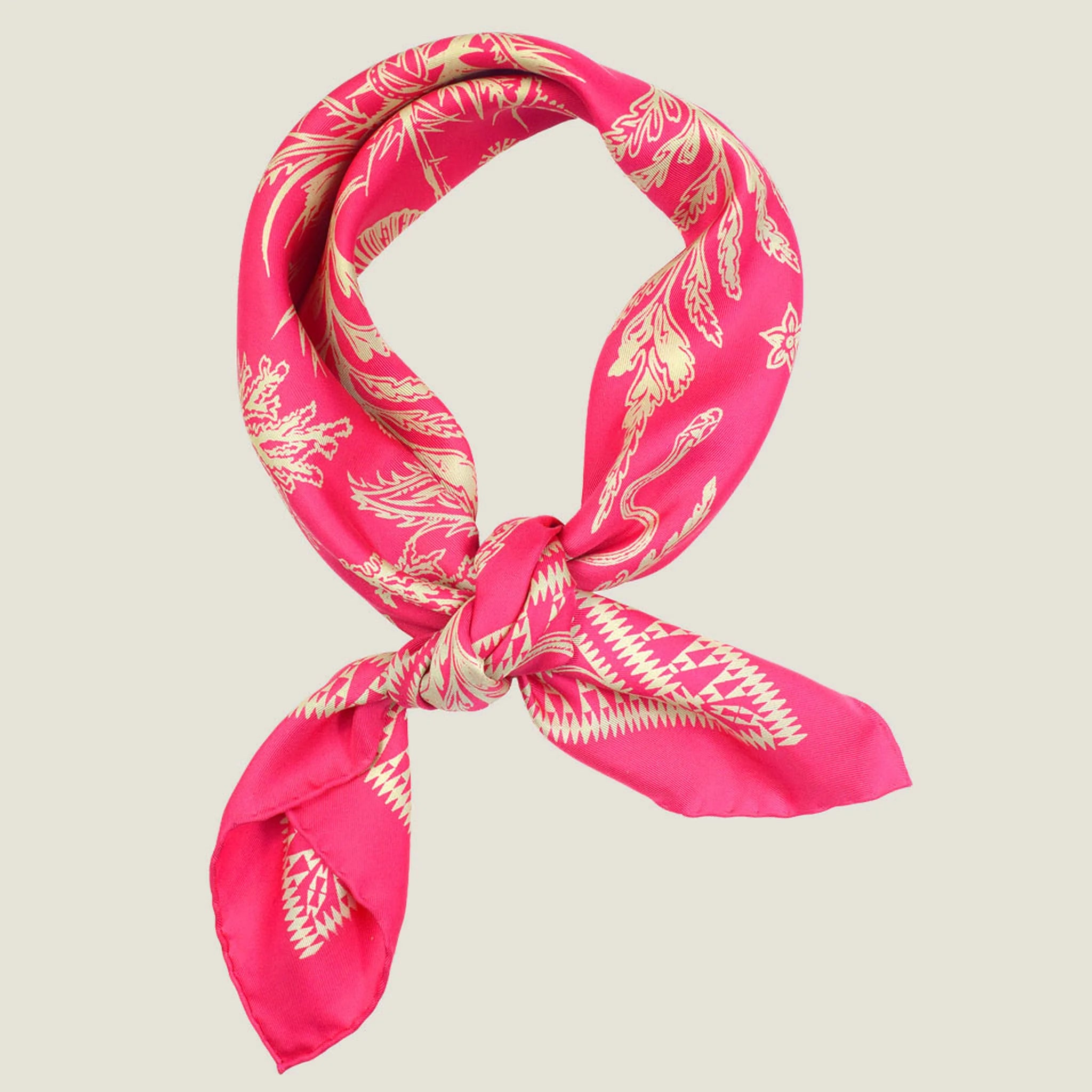 Laslett England Marettimo Cerise Silk Bandana knotted at side of neck, showing cerise pink and cream coastal print on 100% silk twill.