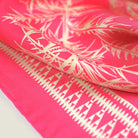 Laslett England Marettimo Cerise Silk Bandana detail showing cream discharge-printed coastal botanical and maritime motifs on cerise pink silk twill.
