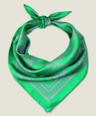 100% silk Marettimo Jewel Green Silk Bandana by Laslett England. Shown knotted at the back and displayed on a neutral background. 
