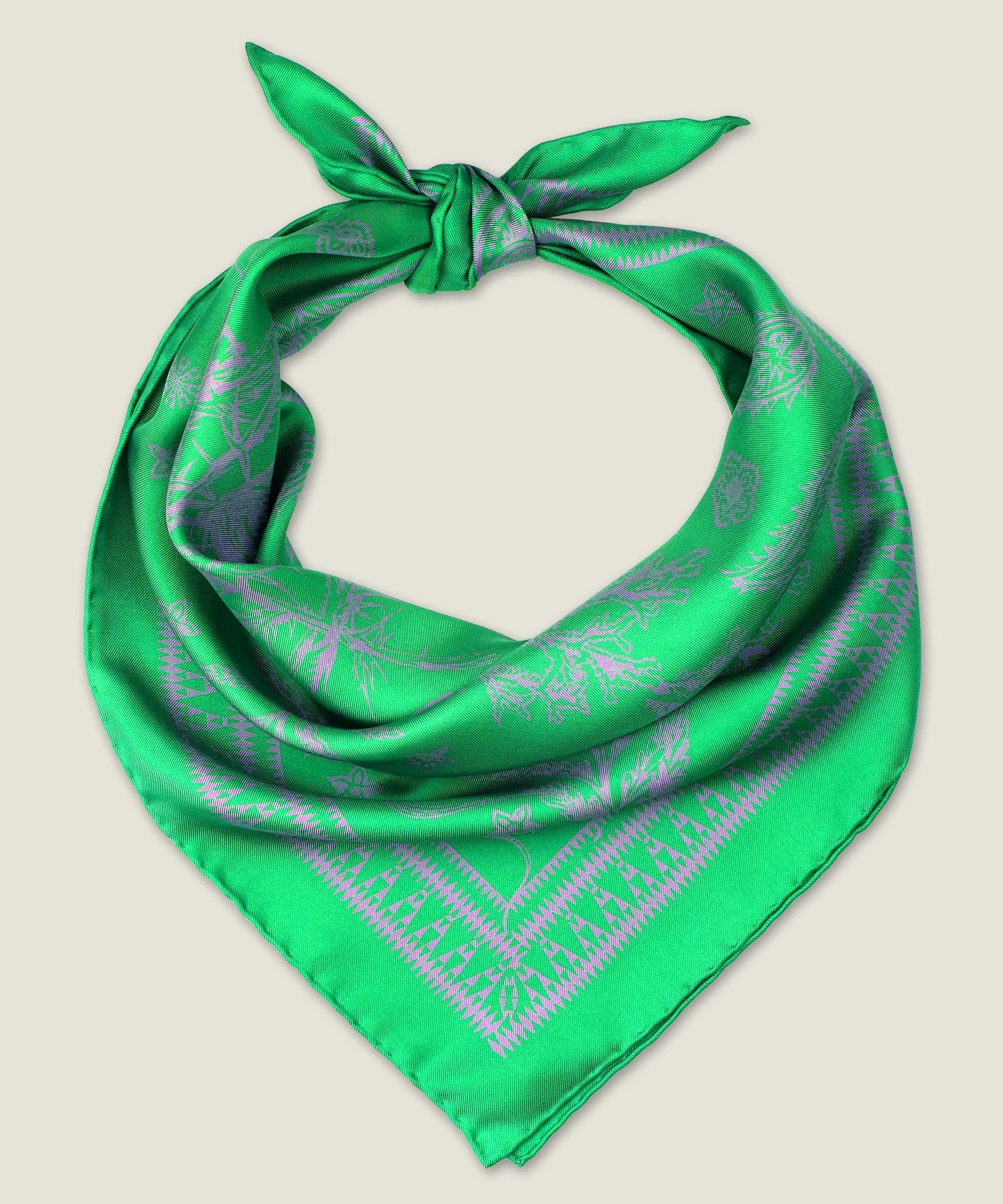 100% silk Marettimo Jewel Green Silk Bandana by Laslett England. Shown knotted at the back and displayed on a neutral background. 