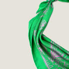 100% silk Marettimo Jewel Green Silk Bandana by Laslett England shown in close up to reveal the pink botanical and maritime detail. 