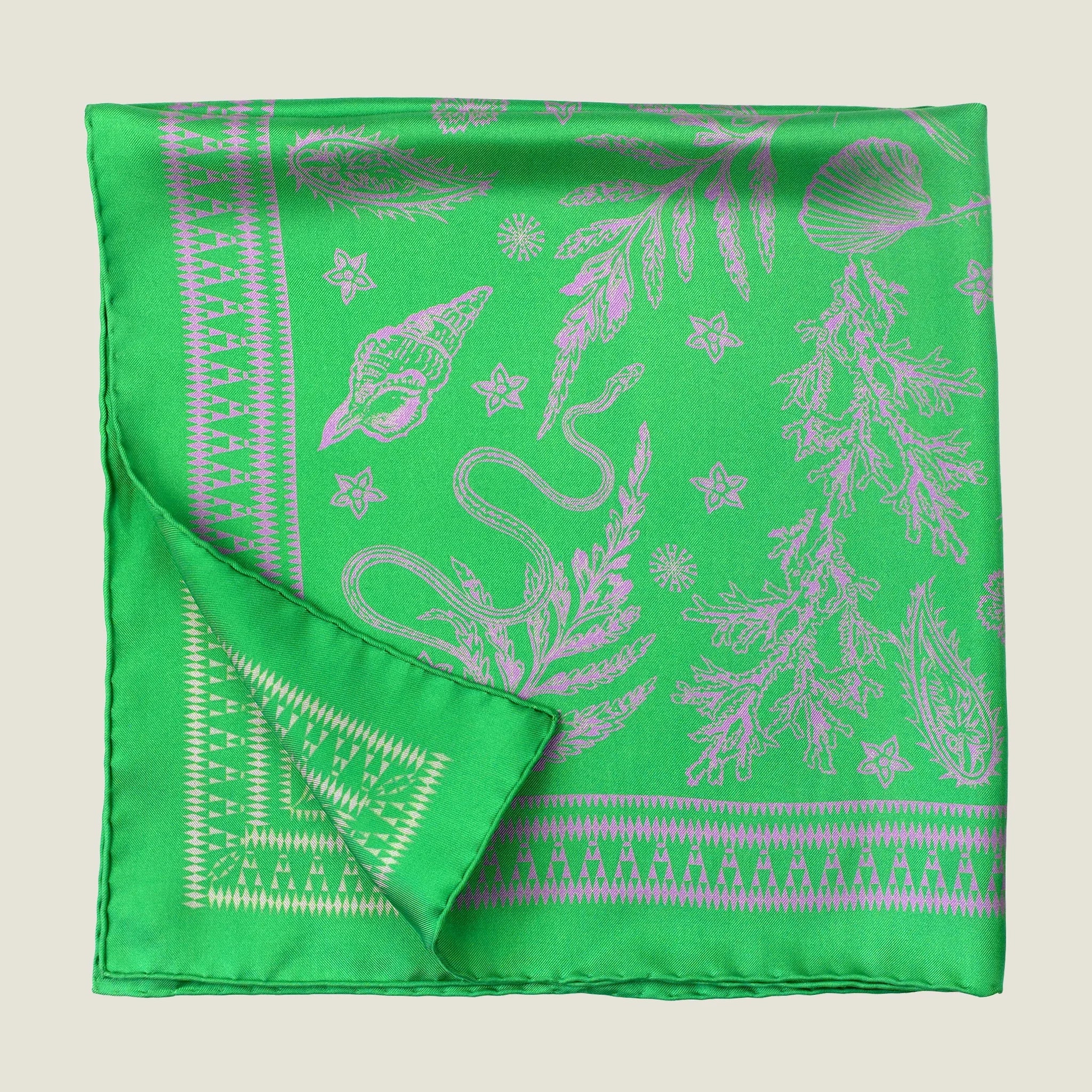 100% silk Marettimo Jewel Green Silk Bandana by Laslett England shown folded into four in flat lay against a neutral background. 