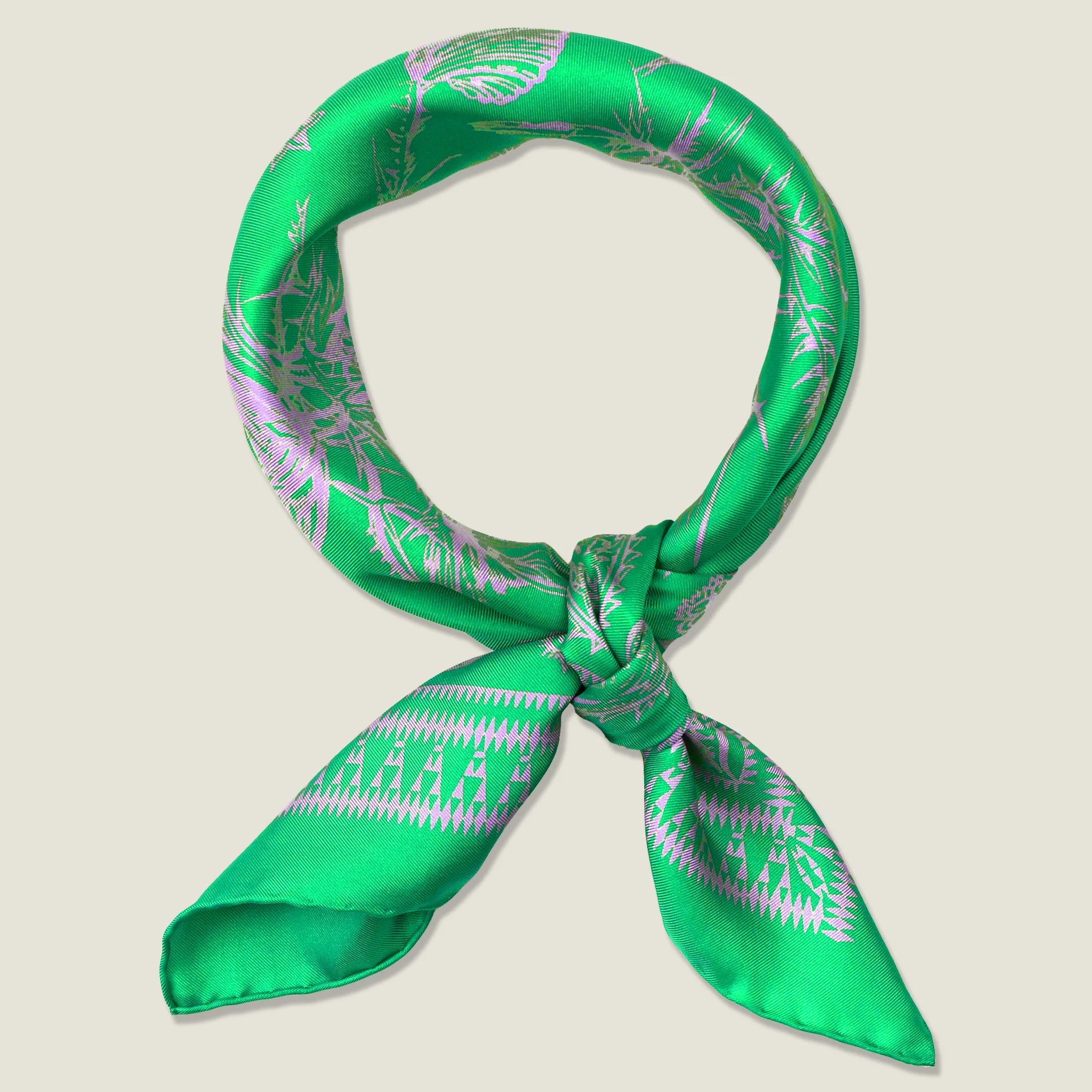 100% silk Marettimo Jewel Green Silk Bandana by Laslett England. Shown knotted at the front against a neutral background. 