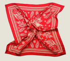 100% silk Marettimo Red Silk Bandana in red by Laslett England. Scarf is shown in flat lay against a neutral background. 