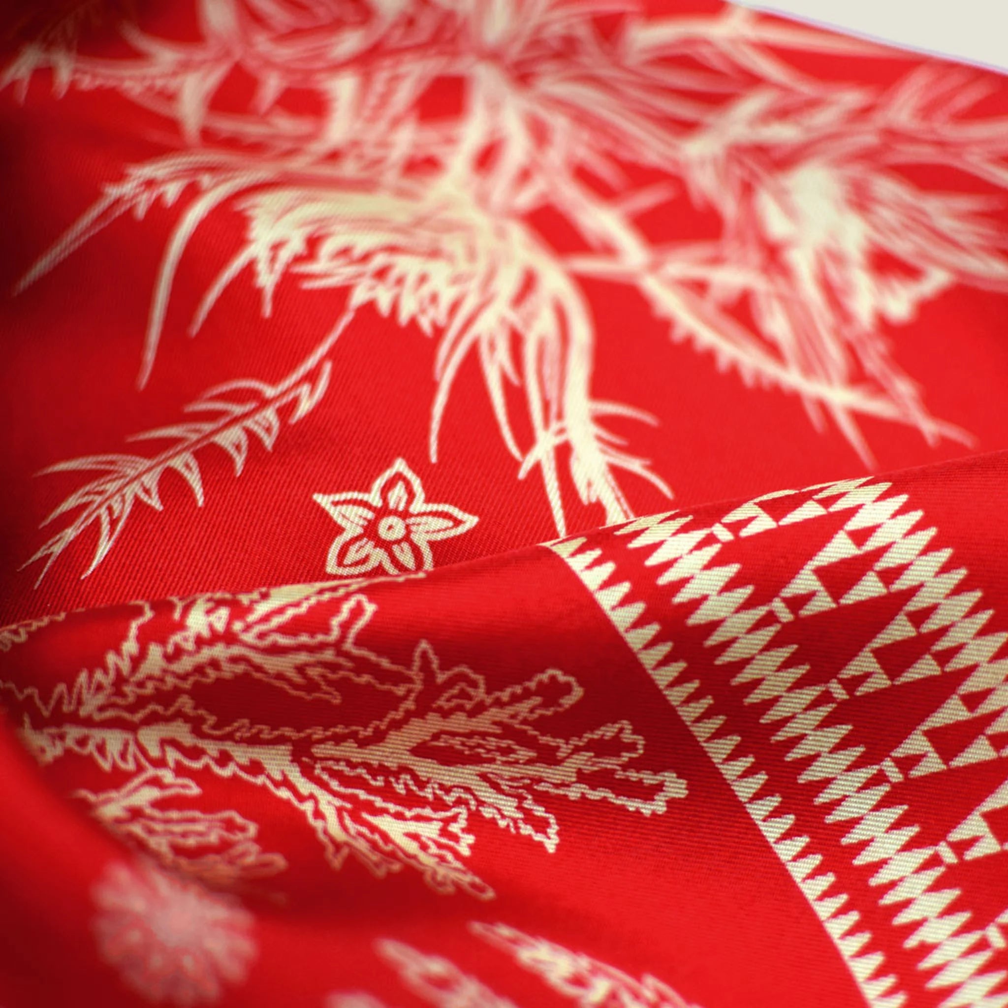 100% silk Marettimo Red Silk Bandana in red by Laslett England. Shown in close up to reveal the maritime and botanical details. 