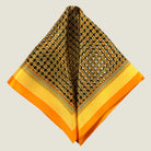100% silk Matrix Gold Pocket Square has a futuristic geometric design that reveals, on closer inspection, repeating graphic lines and patterns across the surface. Square is shown folded into two triangles on a neutral background. 