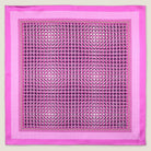 This Matrix Pink pocket square has a striking geometric design that reveals, on closer inspection, repeating graphic lines and patterns. In soft dusty pink with charcoal and white, square is shown in flat lay against a neutral background. 